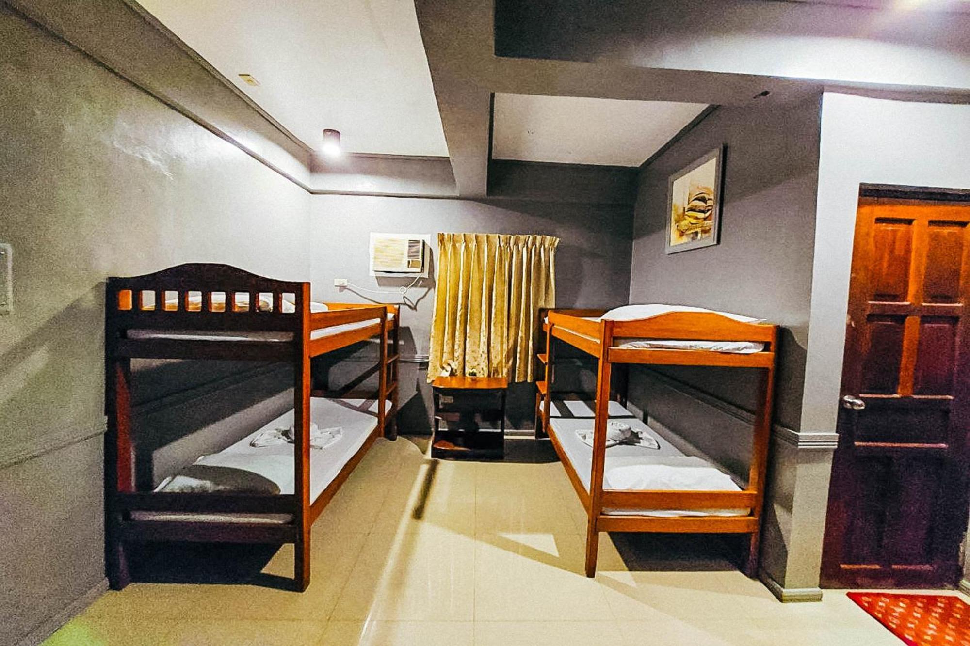 Mbg Travellers Inn Powered By Cocotel Puerto Princesa Szoba fotó