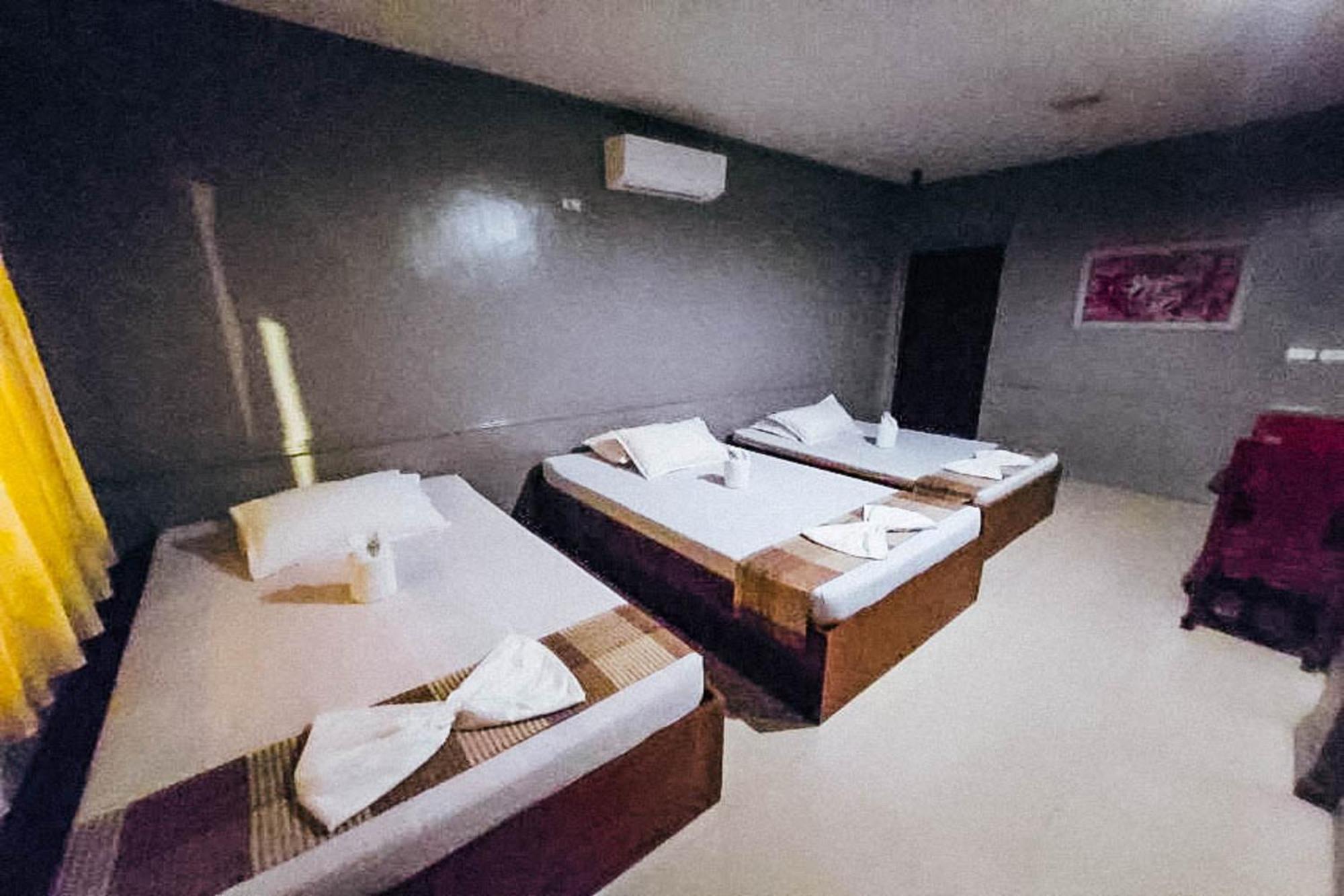 Mbg Travellers Inn Powered By Cocotel Puerto Princesa Szoba fotó