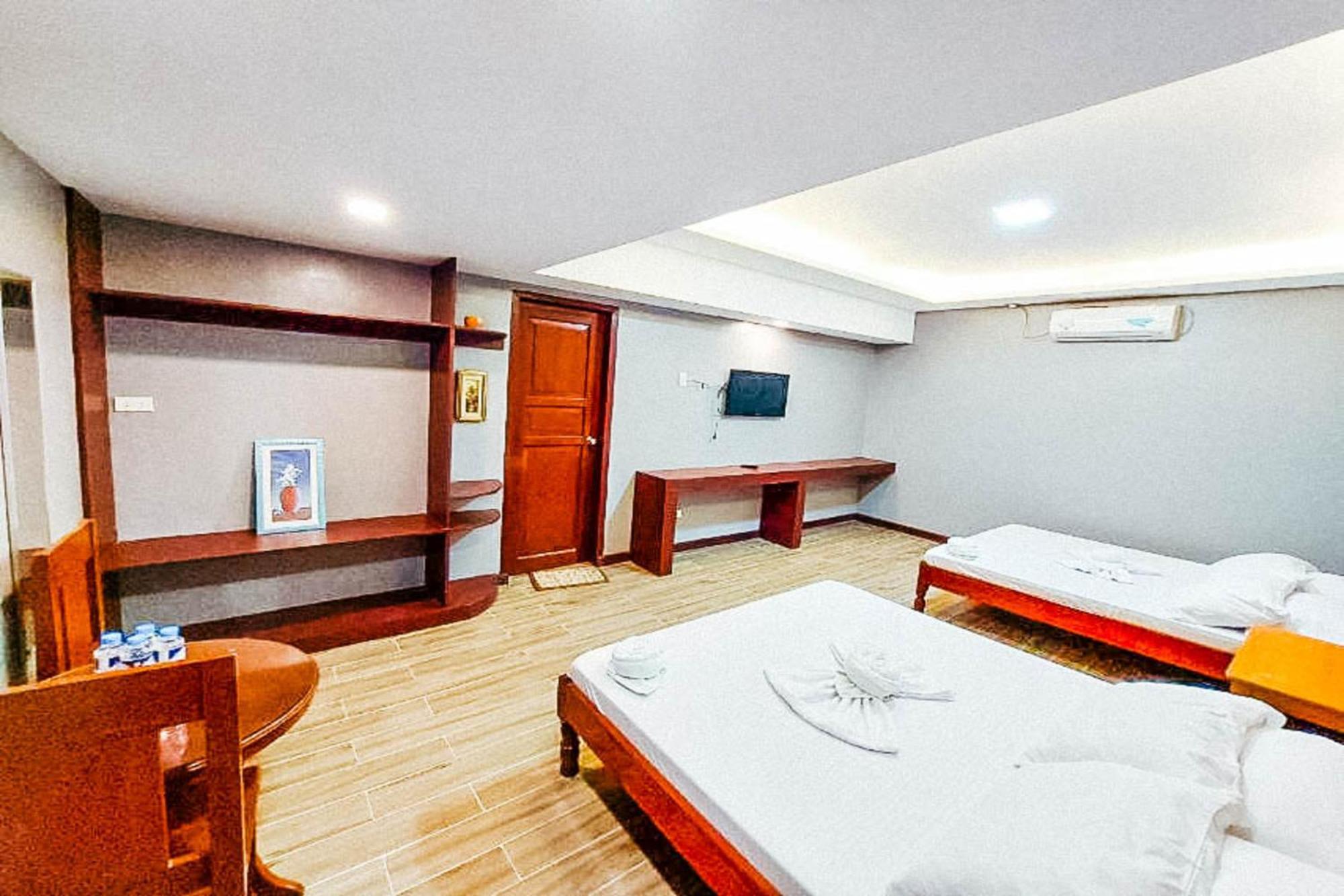 Mbg Travellers Inn Powered By Cocotel Puerto Princesa Szoba fotó