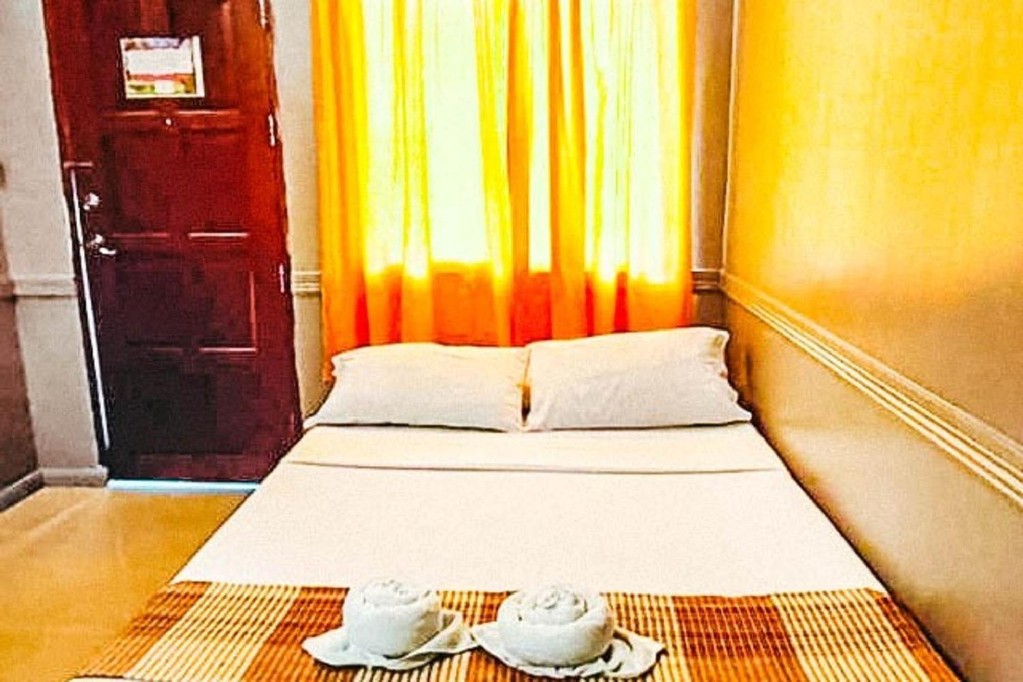 Mbg Travellers Inn Powered By Cocotel Puerto Princesa Szoba fotó
